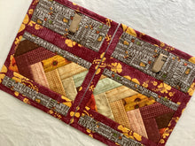 Load image into Gallery viewer, A set of colorful patchwork placemats with a floral and geometric pattern, displayed on a neutral background.