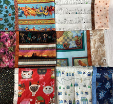 Load image into Gallery viewer, A variety of pillowcases with different designs and fabrics displayed side by side.