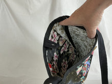Load image into Gallery viewer, Interior of floral-patterned bag with key fob