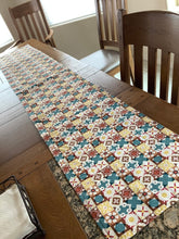 Load image into Gallery viewer, Colorful patterned table runner on a wooden dining table with chairs.