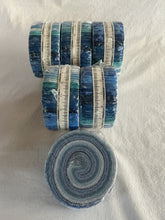 Load image into Gallery viewer, Roll of blue, green, and white fabrics