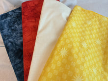 Load image into Gallery viewer, Four folded fabrics showing different color and pattern options: dark blue marbled fabric, red patterned fabric, cream fabric, and yellow fabric with a repeating sunburst and small square motif.
