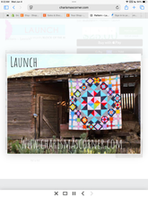 Load image into Gallery viewer, Colorful quilt hanging on a wooden building with 'charismascorner.com' displayed.
