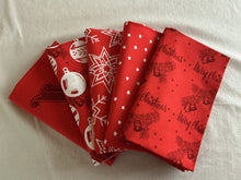 Load image into Gallery viewer, Red fabric swatches with Christmas patterns on a white background
